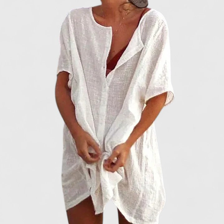 Short sleeve women's tunic dress, offering elegant and casual summer fashion for warm weather.