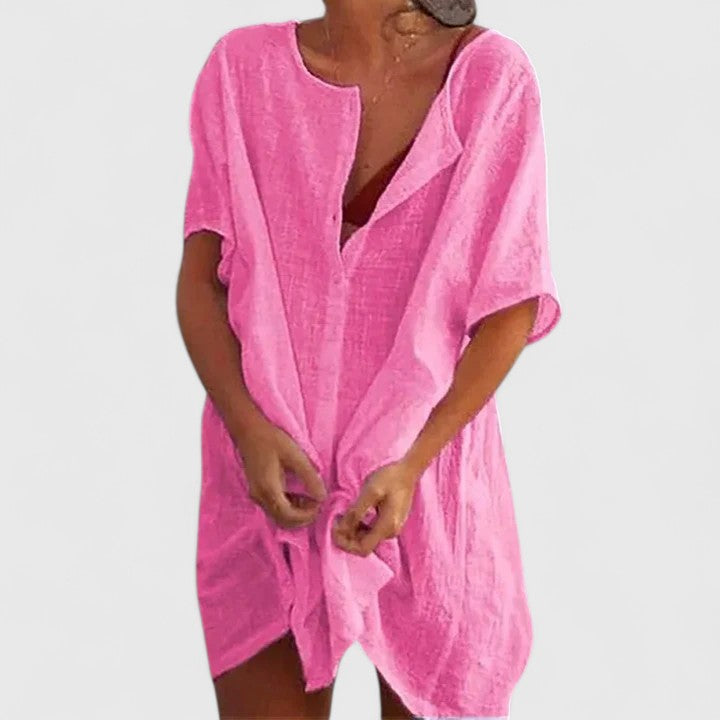 Elegant short sleeve tunic dress, styled for women's sophisticated day-to-night summer fashion.