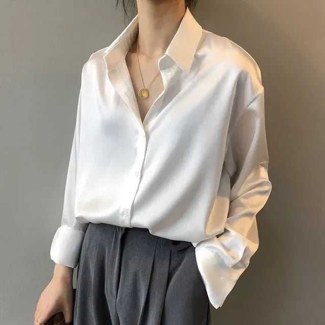 Stylish women's long sleeve blouse with a relaxed fit and elegant button-down design, versatile for any look.