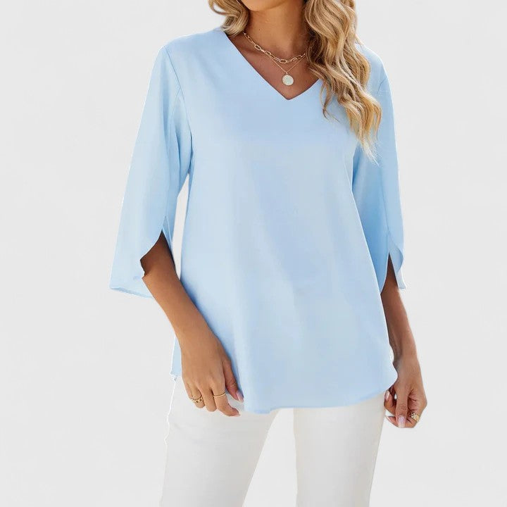 Chic women's workwear blouse. Elegant long-sleeve top, perfect for professional office style & ladies' fashion.