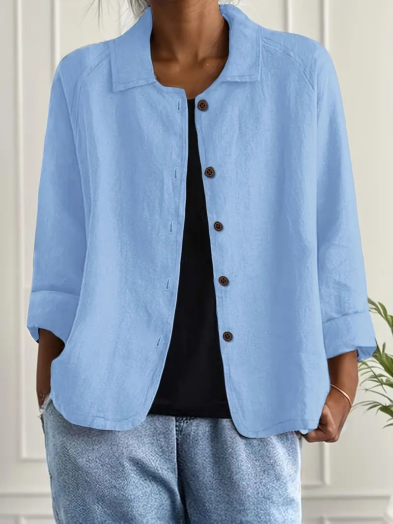 Elegant women's long sleeve button-up blouse, relaxed fit. Perfect for sophisticated workwear or casual chic style.