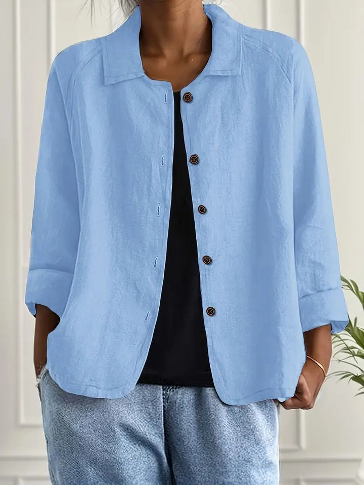 Elegant women's long sleeve button-up blouse, relaxed fit. Perfect for sophisticated workwear or casual chic style.