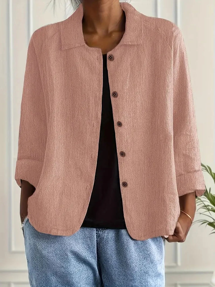 Sophisticated women's collared shirt. Long sleeve button-up blouse with open collar, a versatile stylish top.