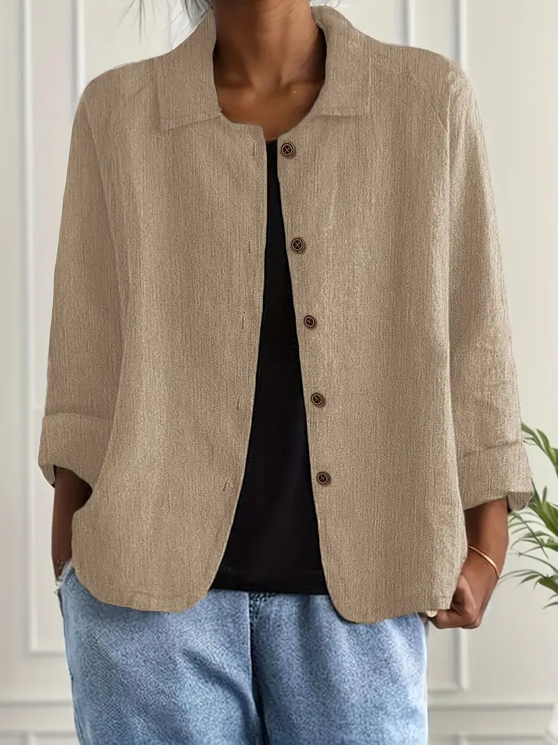 Versatile women's long sleeve button-up blouse. Elegant workwear or casual chic top with a relaxed fit.