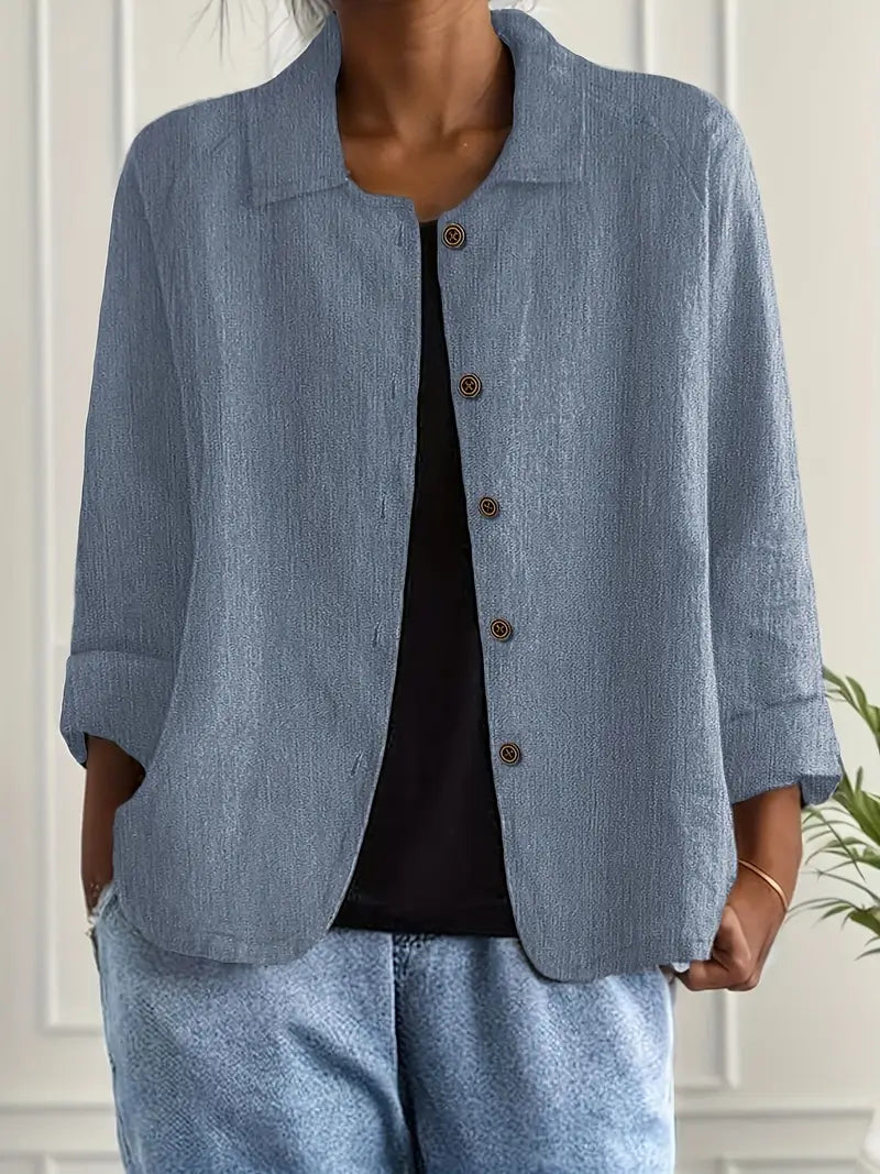 Classic white elegant women's long sleeve button-up blouse. Relaxed fit collared shirt, perfect for any occasion.