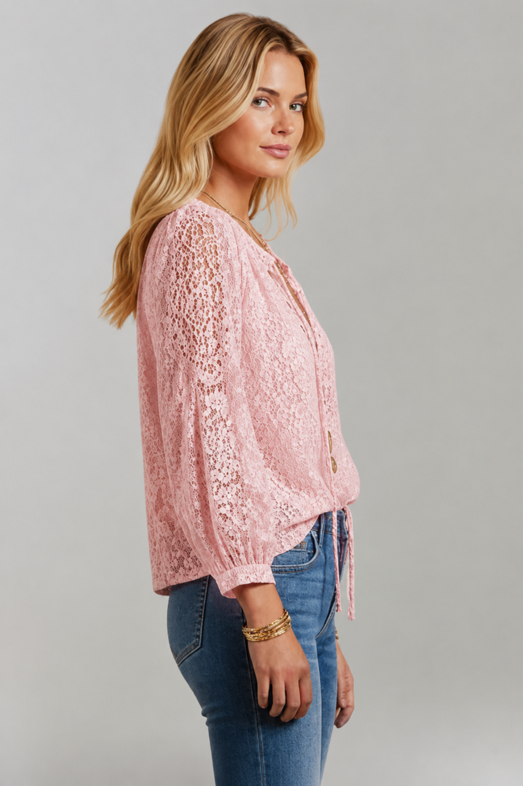 Sheer women's long sleeve lace blouse with an elegant tied neckline. Fashionable & comfortable.