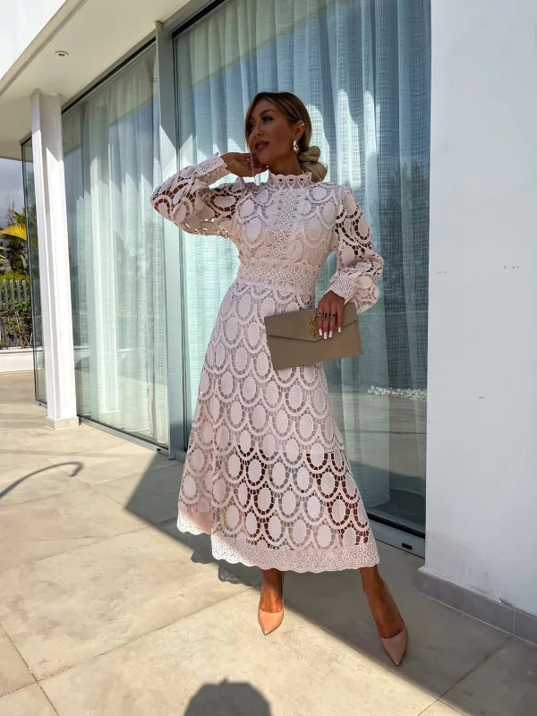 Elegant women's long sleeve lace midi dress, perfect for a wedding guest or formal party. Sophisticated and chic.