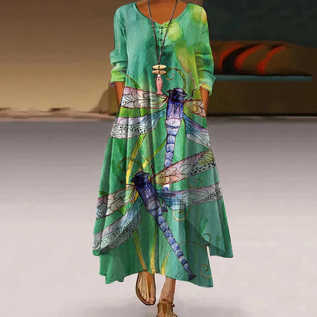 Chic women's spring midi dress with vibrant print, flowy fabric & long sleeves.