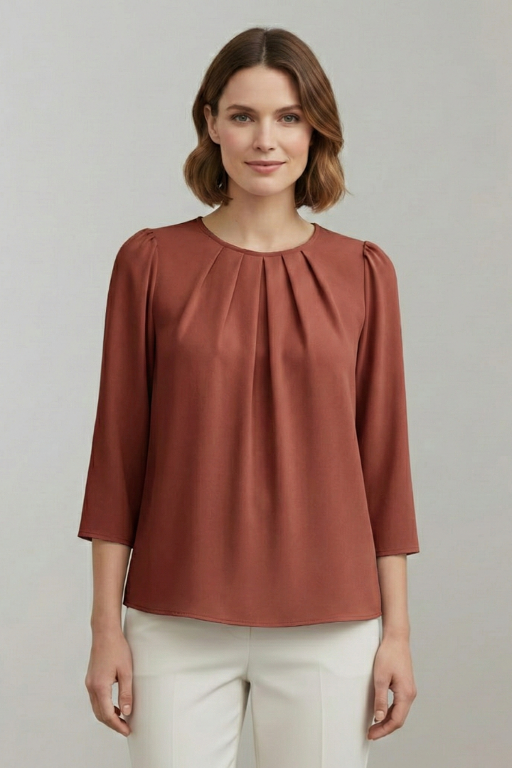 Women's long sleeve pleated front blouse. Elegant, versatile, and stylish top for office or casual outfits.