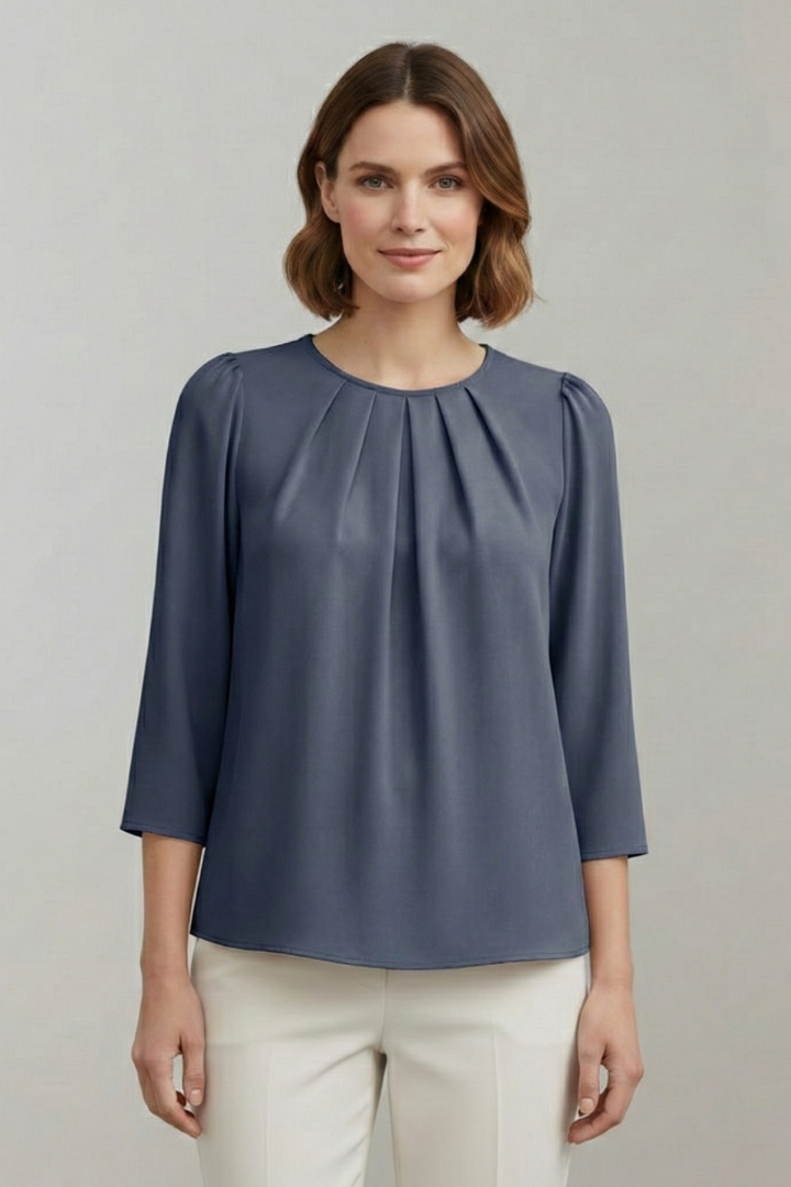 Pleated front detail on this elegant women's long sleeve blouse. Perfect for office or chic casual looks.