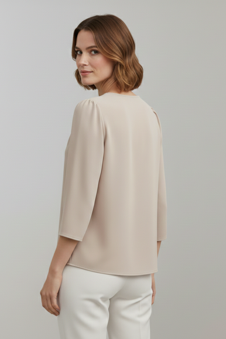 Chic women's long sleeve pleated blouse. A versatile and elegant top ideal for work or fashionable casual attire.