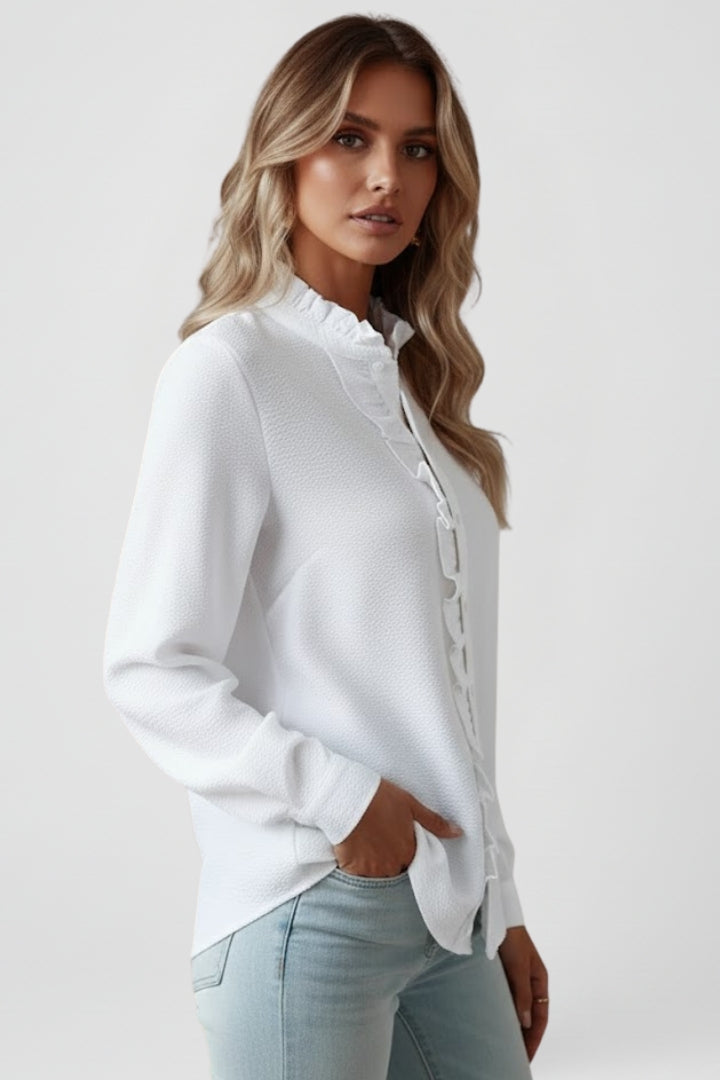 Fashionable textured women's long sleeve blouse with ruffles & button-front detail. Versatile elegant top.