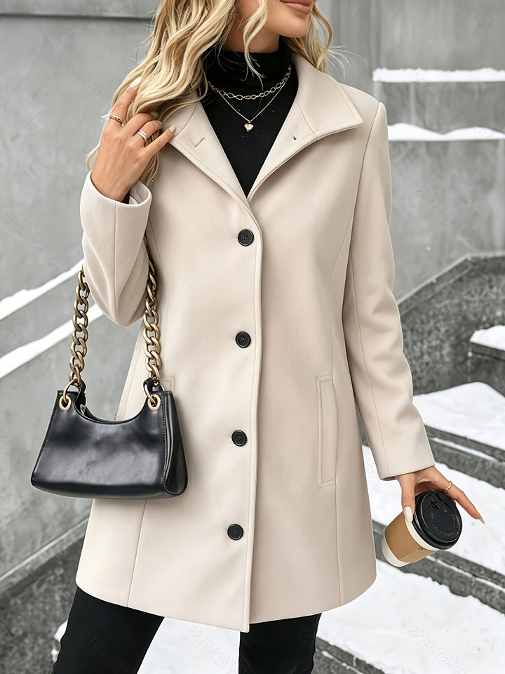 Chic women's longline coat, single breasted, elegant notch collar. A versatile piece for fall & winter.