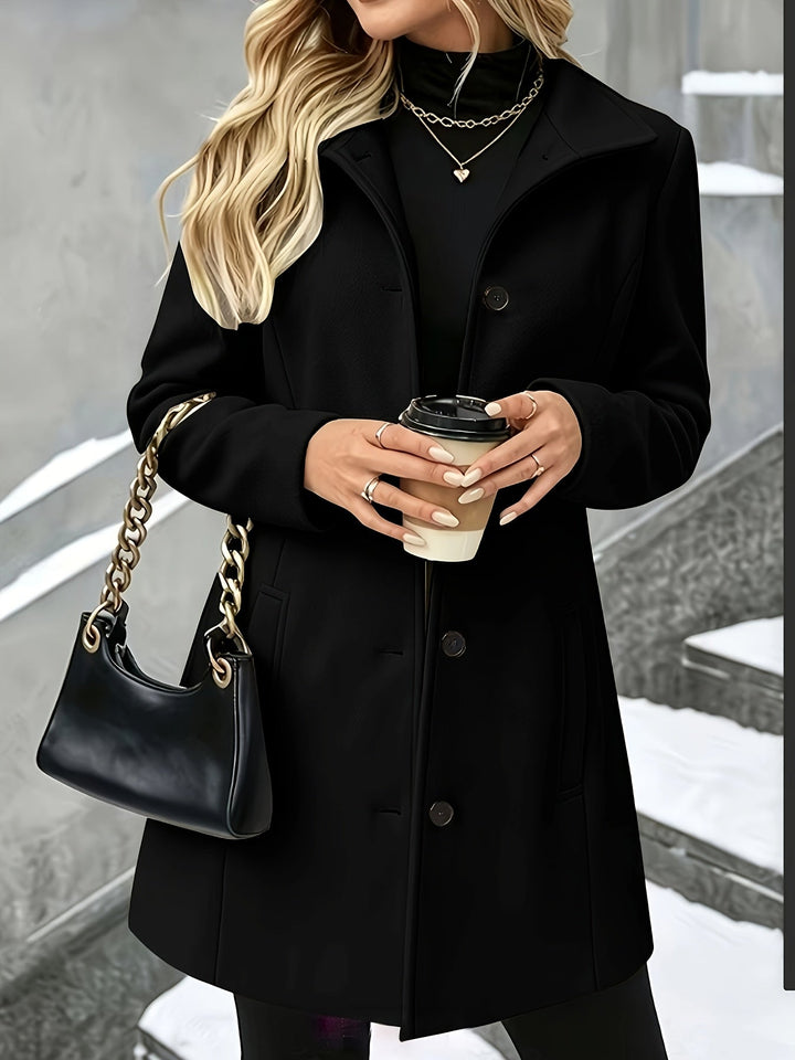 Women's elegant single breasted longline coat in camel, with a chic notch collar. Classic outerwear.