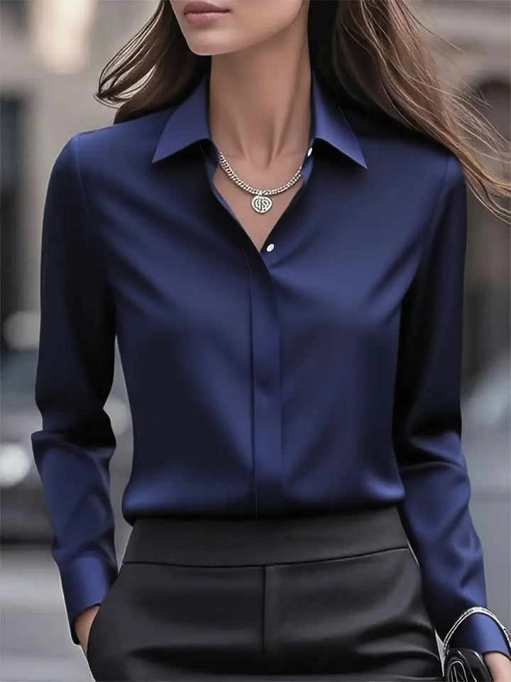 Model wearing professional women's luminous button blouse, showcasing its elegant fit and long sleeves.