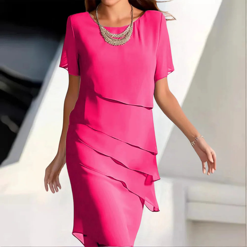 Flowy women's midi dress, elegant & versatile with a round neck and short sleeves, ideal for party or casual wear.