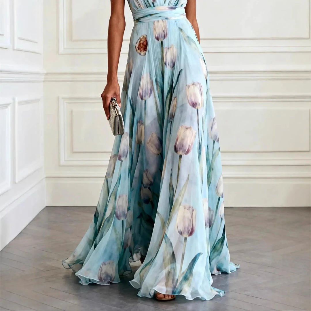 Sleeveless elegant evening maxi dress with vibrant tulip print, perfect for a wedding guest or special occasion.