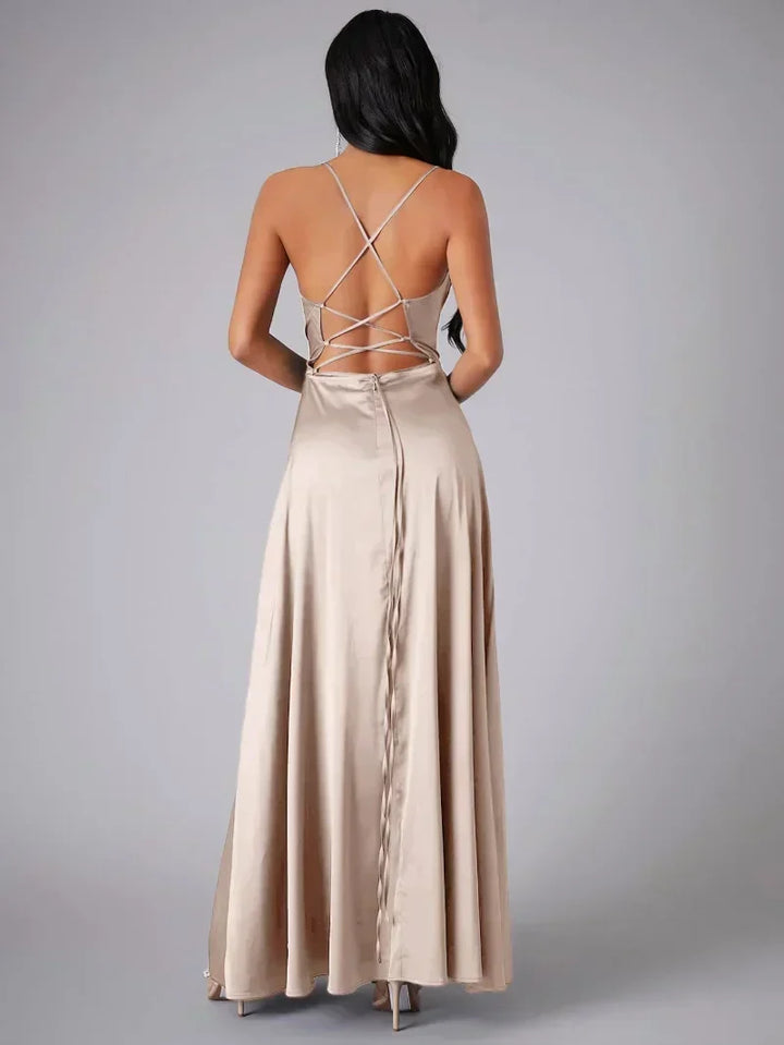 Stunning women's formal evening gown for special occasions. Features an elegant high slit & open back.