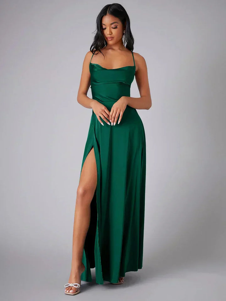 Women's floor-length maxi dress with alluring open back, high slit, & chic draped neckline. Ideal for galas.