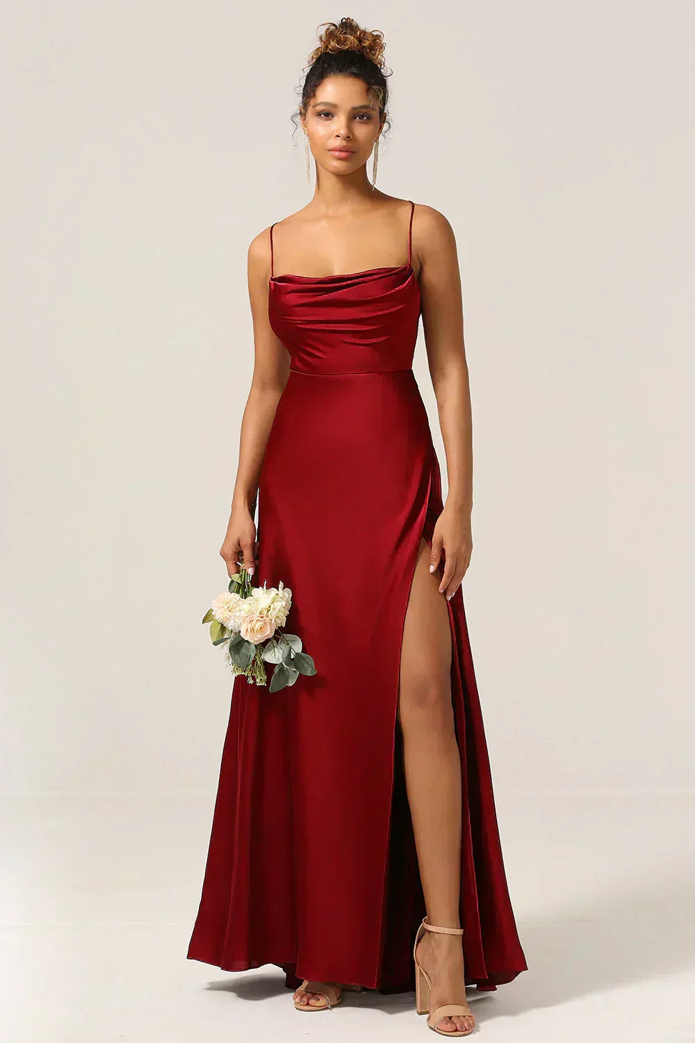 Glamorous women's formal dress for evening events. Features a stunning open back & a stylish high slit.