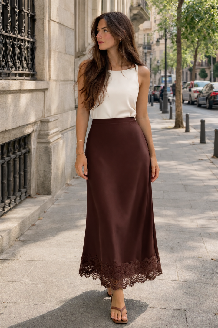 Detailed view of the elegant lace hem on a women's formal maxi skirt, highlighting intricate design.