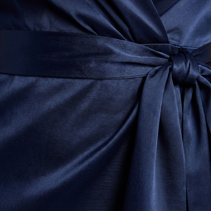 Beautiful women's maxi dress. Elegant formal wear with a flattering tie-waist bow, perfect as a wedding guest dress.