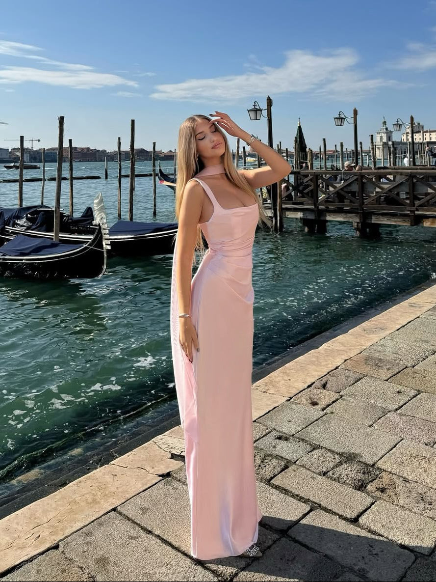 Sleeveless elegant maxi gown for women, ideal as a wedding guest or formal evening dress. Features a chic open back.