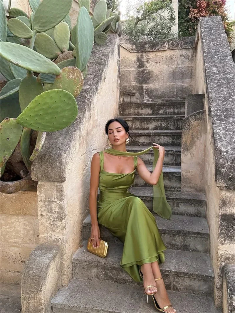 Elegant sleeveless maxi gown for women, perfect for special occasions or as a wedding guest dress. Features an open back.