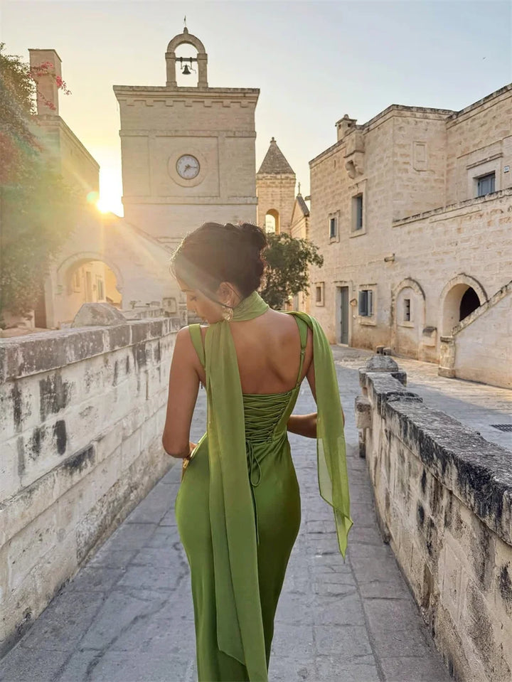 Women's elegant maxi wedding guest dress. Sleeveless, open back, and formal style. Ideal for evening events & parties.