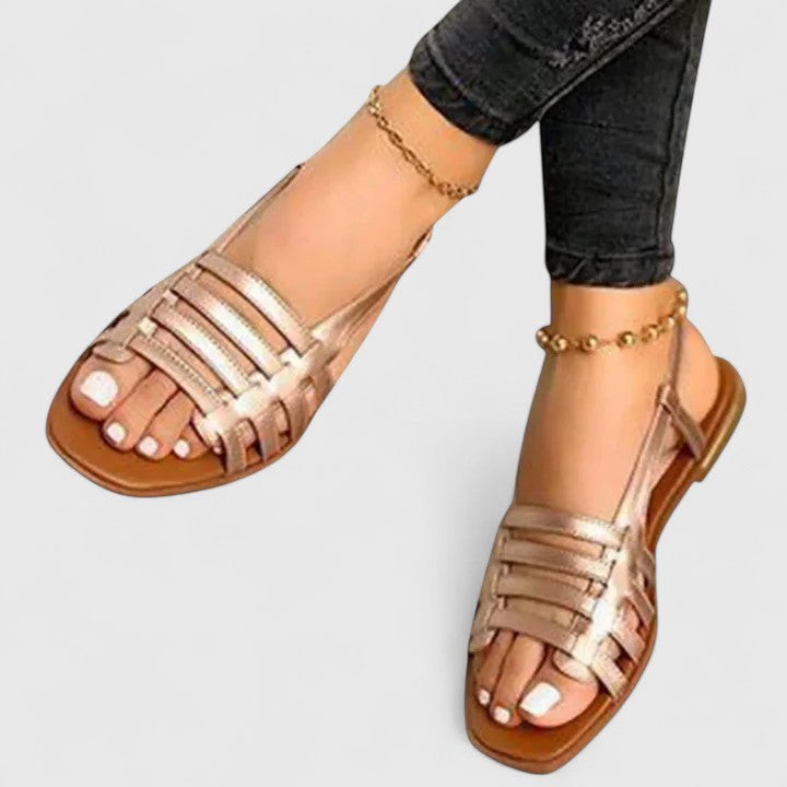 Stylish metallic woven slingback flat sandals for women, perfect for casual summer wear or elegant vacation outfits.