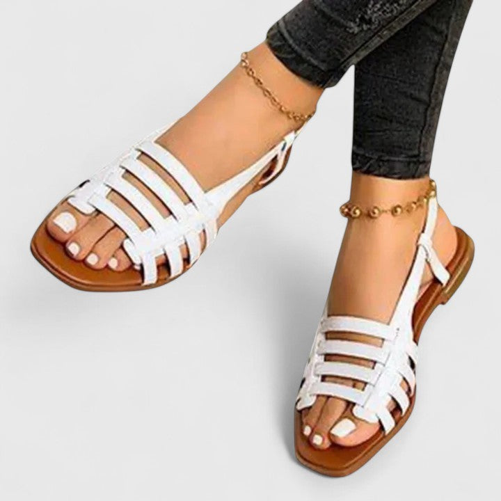 Comfortable black metallic woven flat slingback sandals for women, featuring an open square toe design.