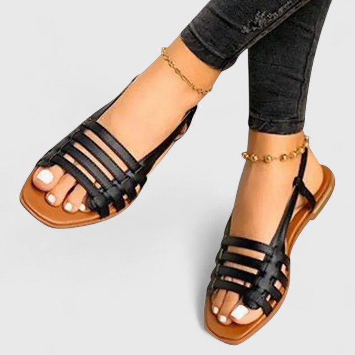 Chic white metallic woven slingback flat sandals for women, ideal as versatile summer shoes.