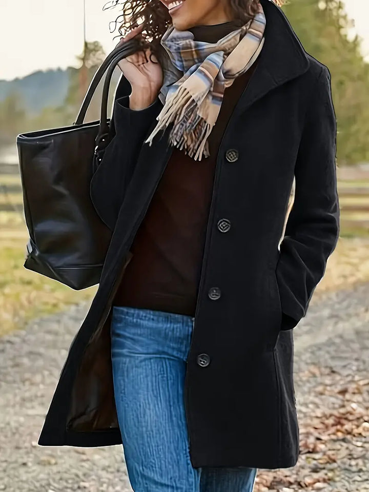 Chic women's mid-length button-down trench coat, a warm and stylish outerwear piece for various occasions.