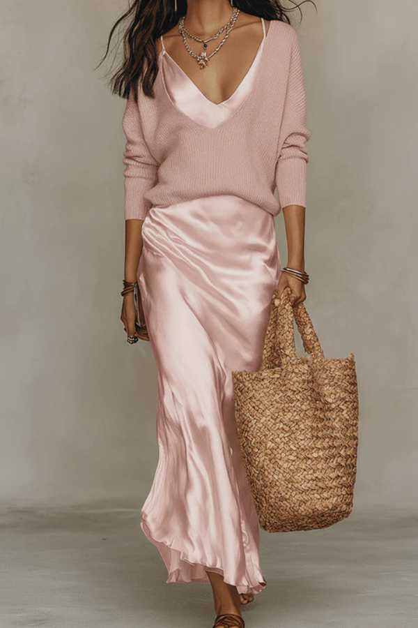 Sophisticated women's midi dress & sweater set, styled for an elegant evening out or special occasion.