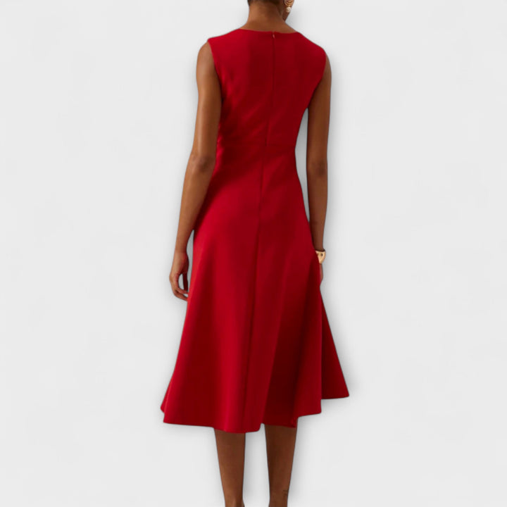 Stylish asymmetric sleeveless midi dress for women. Ideal for parties or cocktail events.