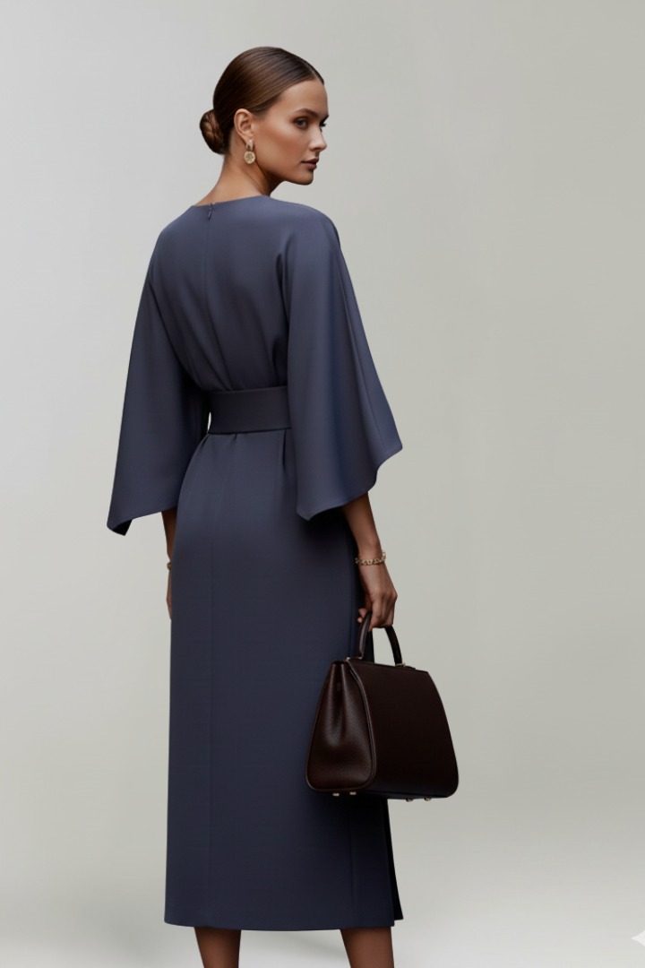 Modest women's midi dress with a round neck, belted waist, & elegant wide sleeves. A formal or casual choice.