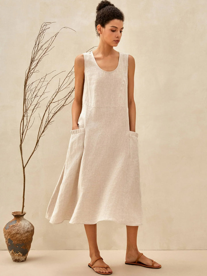 Soft fabric texture of an elegant women's midi dress, designed for breathable summer comfort with pockets.