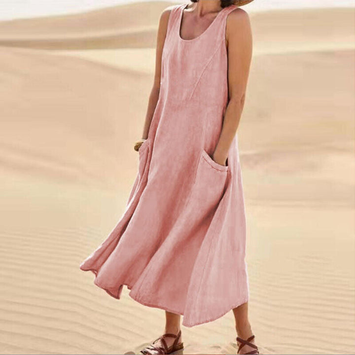 Vibrant spring women's midi dress with a comfortable loose fit and practical pockets for everyday elegance.