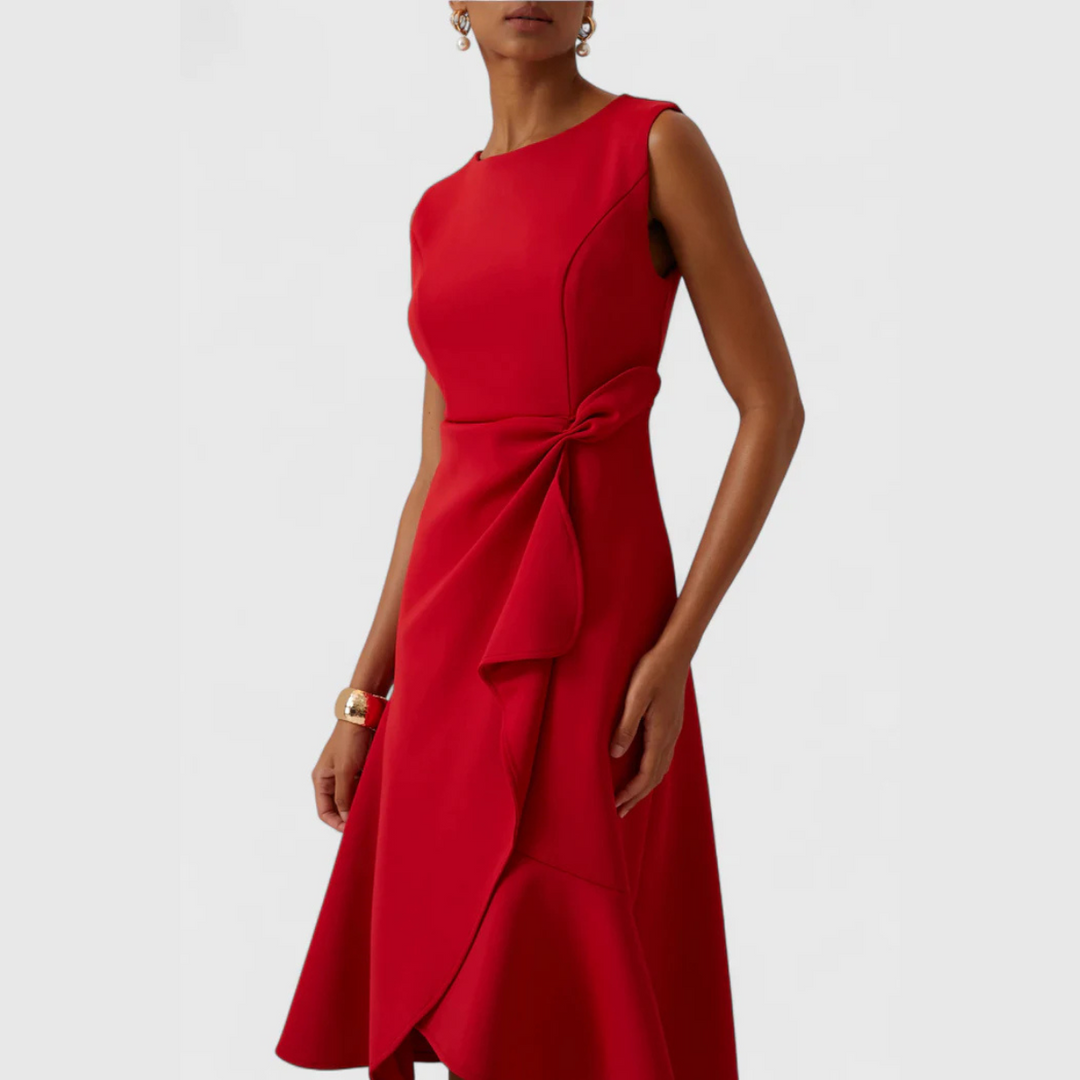 Flattering women's sleeveless midi dress with a round neck, ruffle hem, and chic wrap detail.