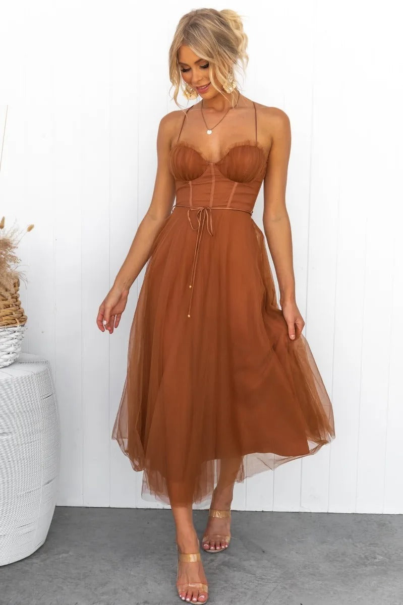 Elegant women's midi wedding guest dress featuring a corset bodice, sweetheart neckline, and flowing tulle skirt.