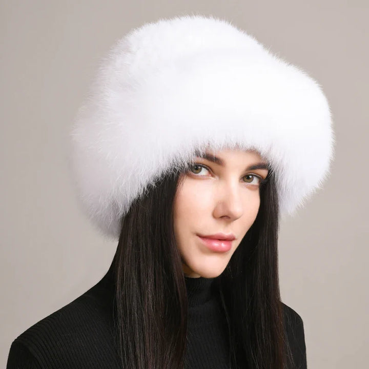 Stylish woman wearing a genuine mink and fox fur hat, perfect for winter warmth and fashion