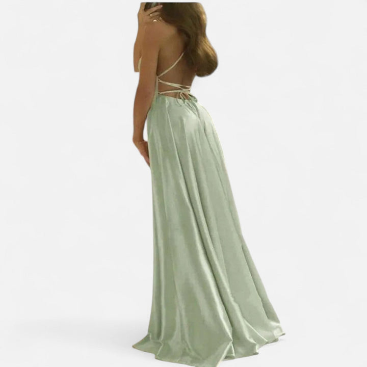Women's satin evening gown, modern fit, featuring a chic slit, ideal for a wedding guest or gala.