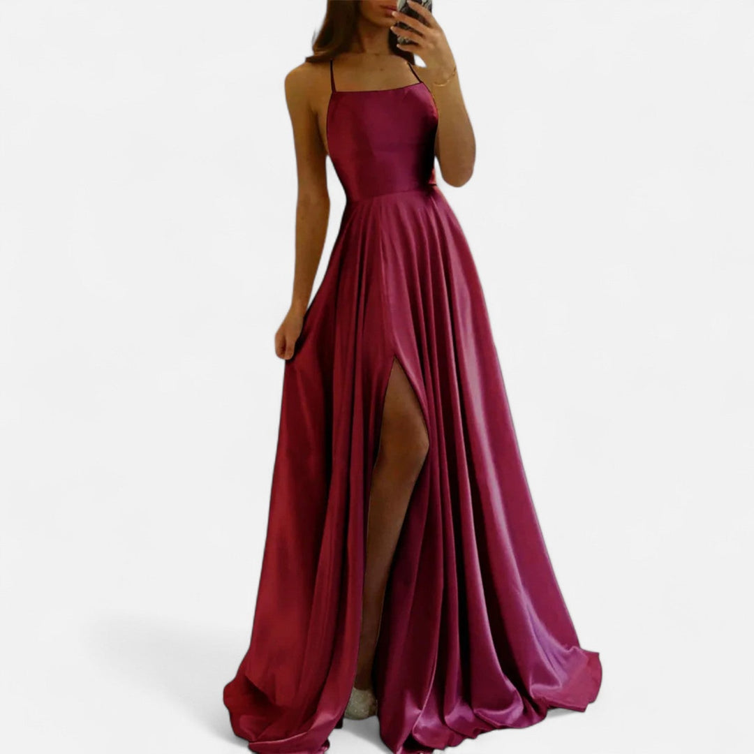 Formal women's maxi dress in smooth satin with a stylish slit, designed for a sophisticated look.