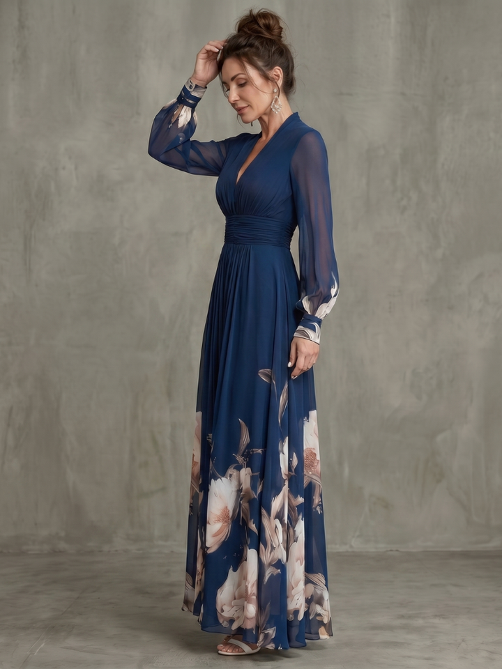 Navy V-neck pleated maxi dress for women, with elegant sheer long sleeves and a flowing silhouette.