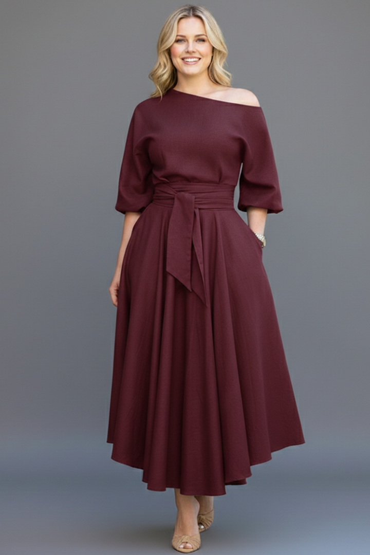 Formal women's midi dress: elegant off-shoulder neckline, graceful lantern sleeves, and a defined silhouette.