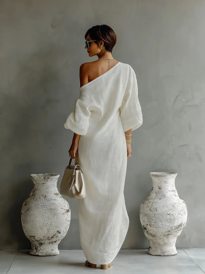 Stylish women's one-shoulder dress with a flowing asymmetrical hem, ideal for summer elegance.