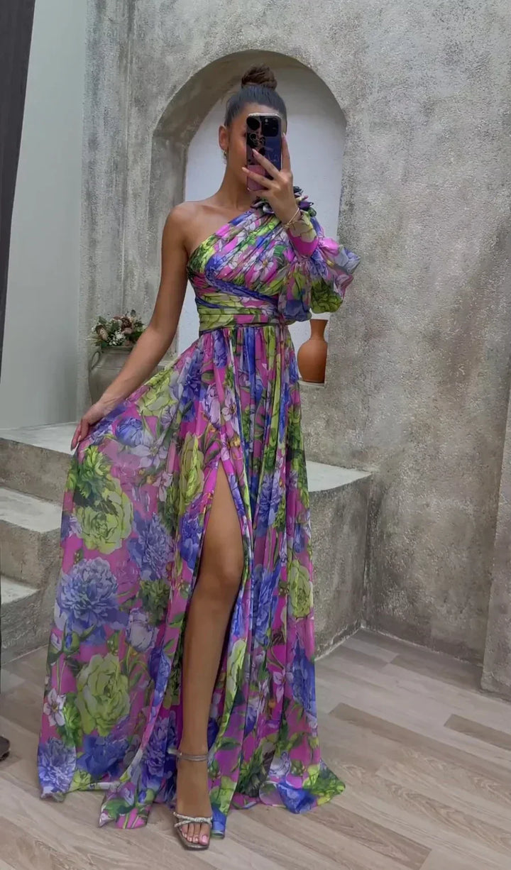 Elegant women's one-shoulder floral maxi dress with a flowy split hem, perfect for summer parties.