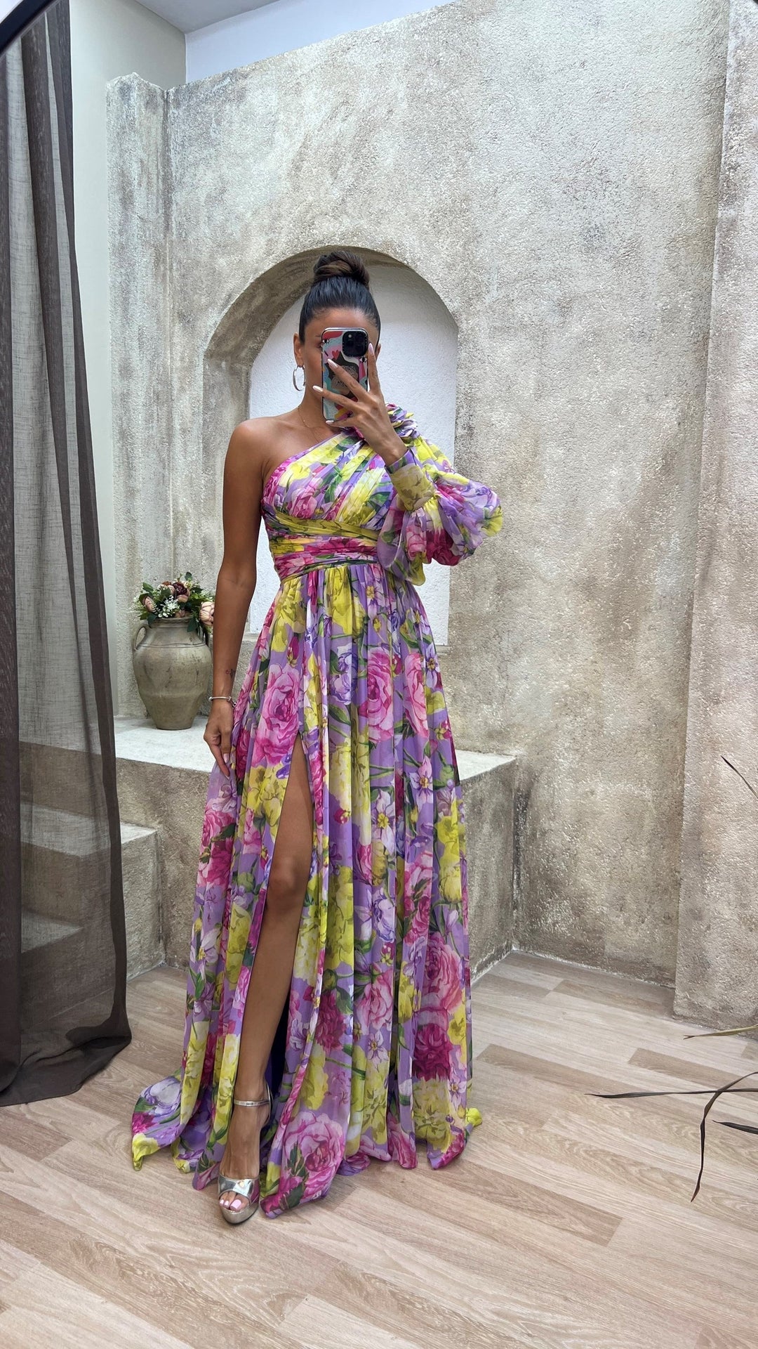 Flowy one-shoulder floral maxi dress for women, ideal for elegant resort wear & special occasions.