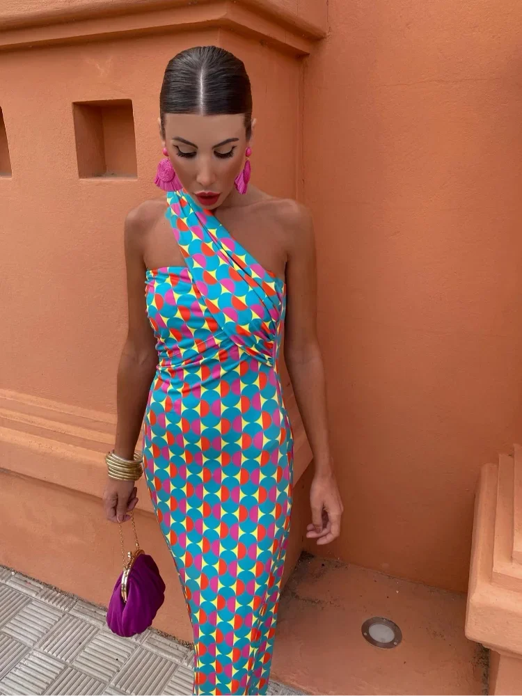 Women's one-shoulder maxi dress featuring a vibrant geometric print, ideal for a stylish summer look.