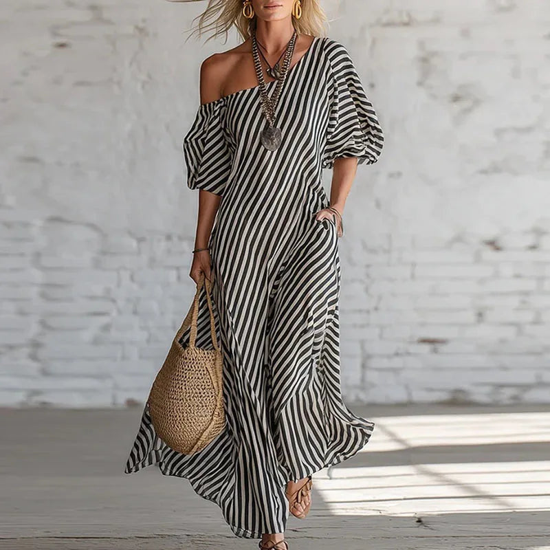 Modern one-shoulder puff sleeve dress for women. Elegant midi length, a stylish statement for summer fashion.